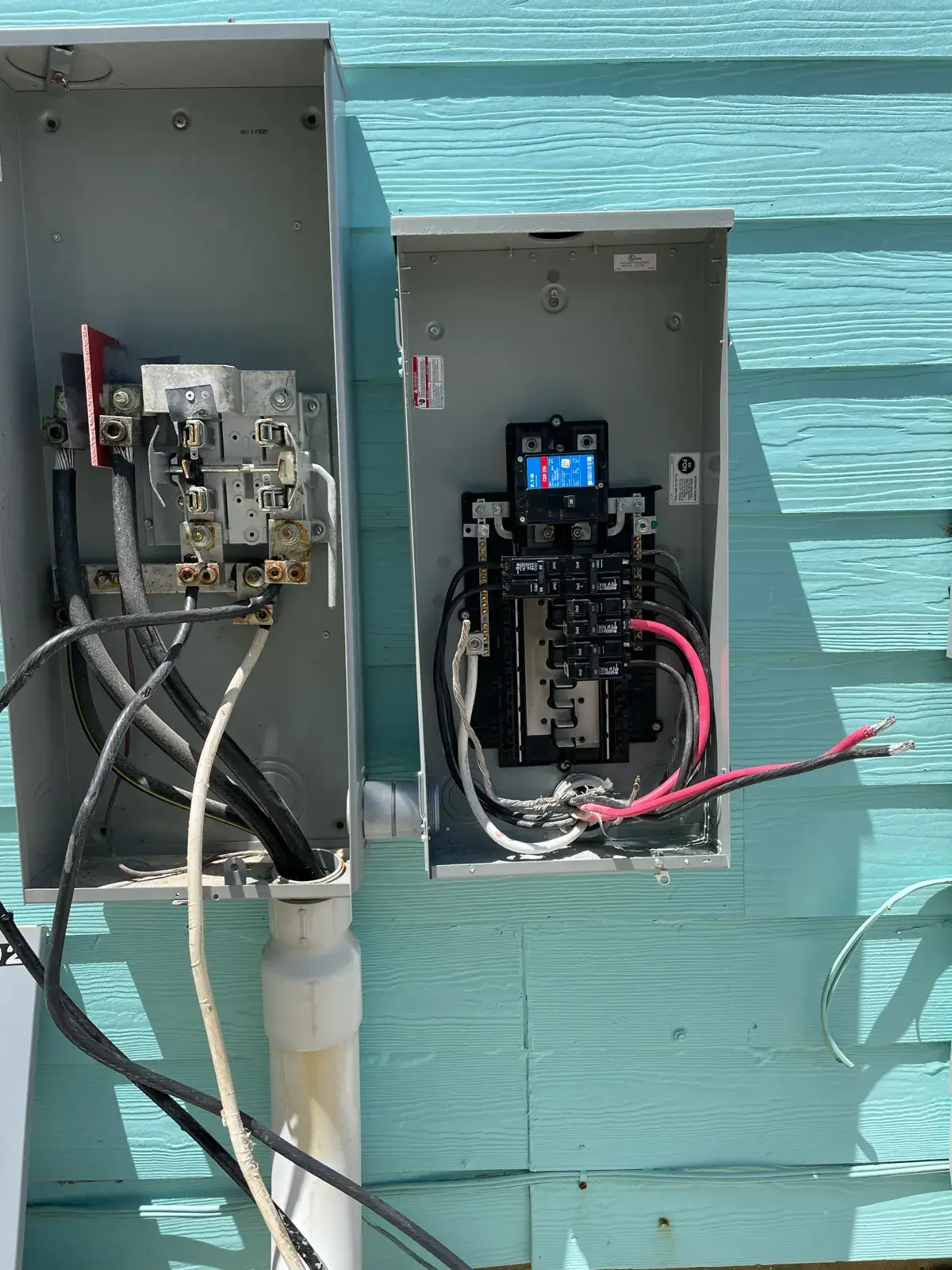 Corroded meter base and panel on a coastal Baldwin County home before replacement