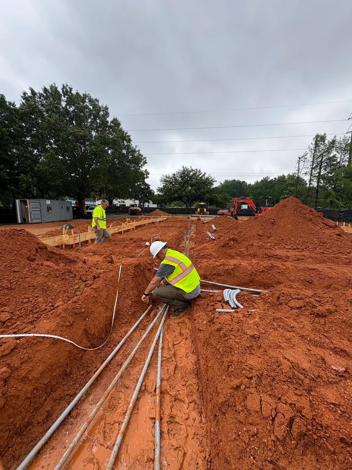 Trenched underground conduit run on a commercial site in Daphne, AL