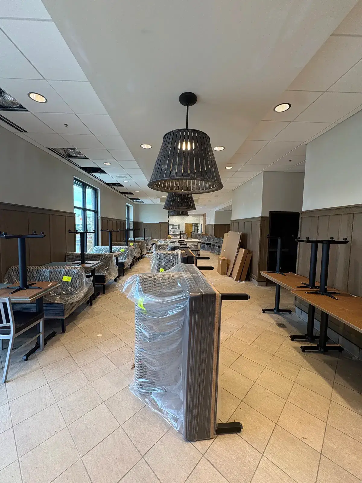 Finished restaurant dining room with feature lighting, Fairhope, AL