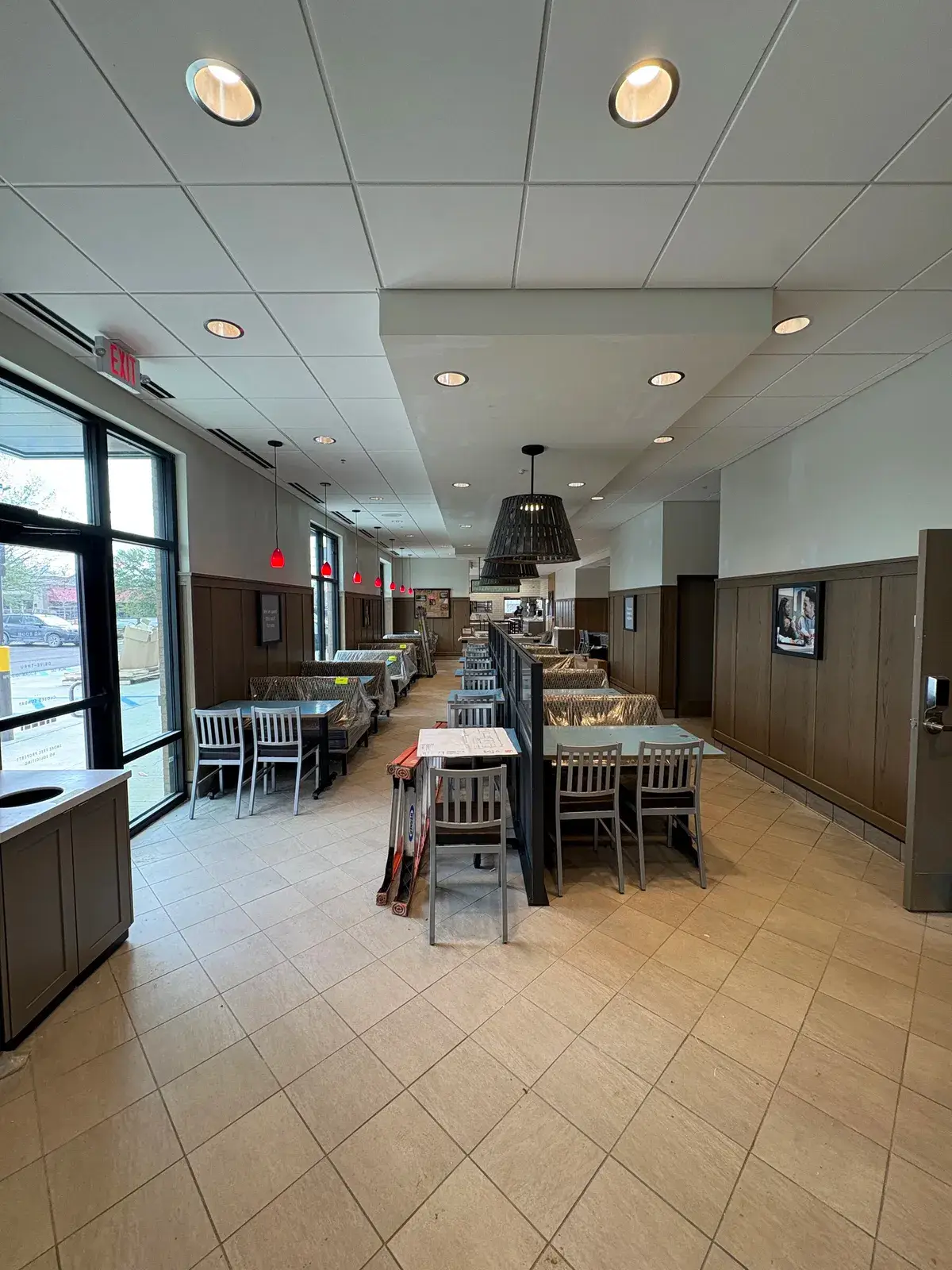 Finished restaurant dining room with feature lighting, alternate view, Fairhope, AL