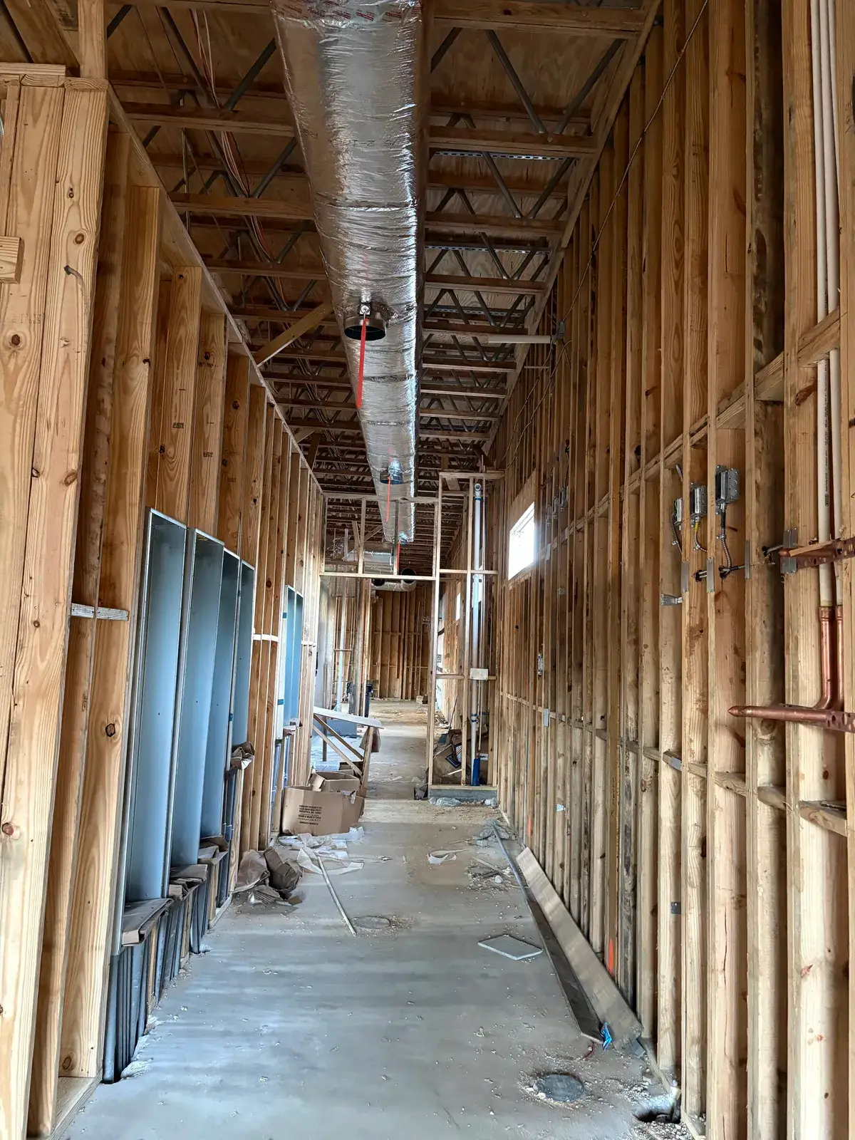 Interior electrical rough-in wiring at a commercial build in Fairhope, AL