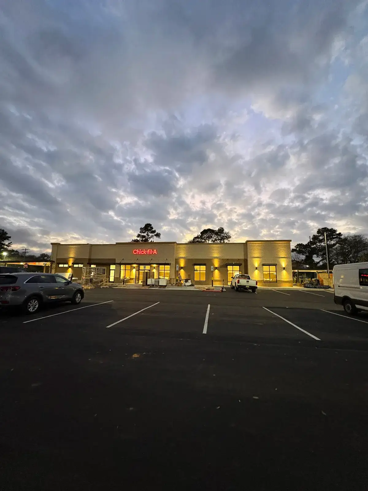 Restaurant exterior lit at dusk, showing exterior and parking lot lighting, Fairhope, AL