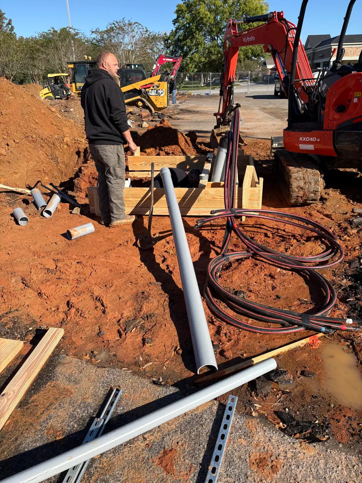 Underground service conduit running to the meter and main disconnect on a Fairhope commercial build