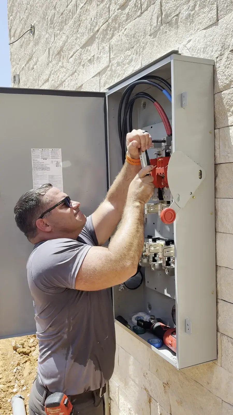 Jimmy Palmer of Wave Electric wiring a commercial service cabinet